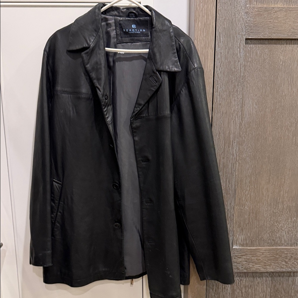 Kenneth Cole Black Leather Jacket. Button closure. Some wear. Good condition.